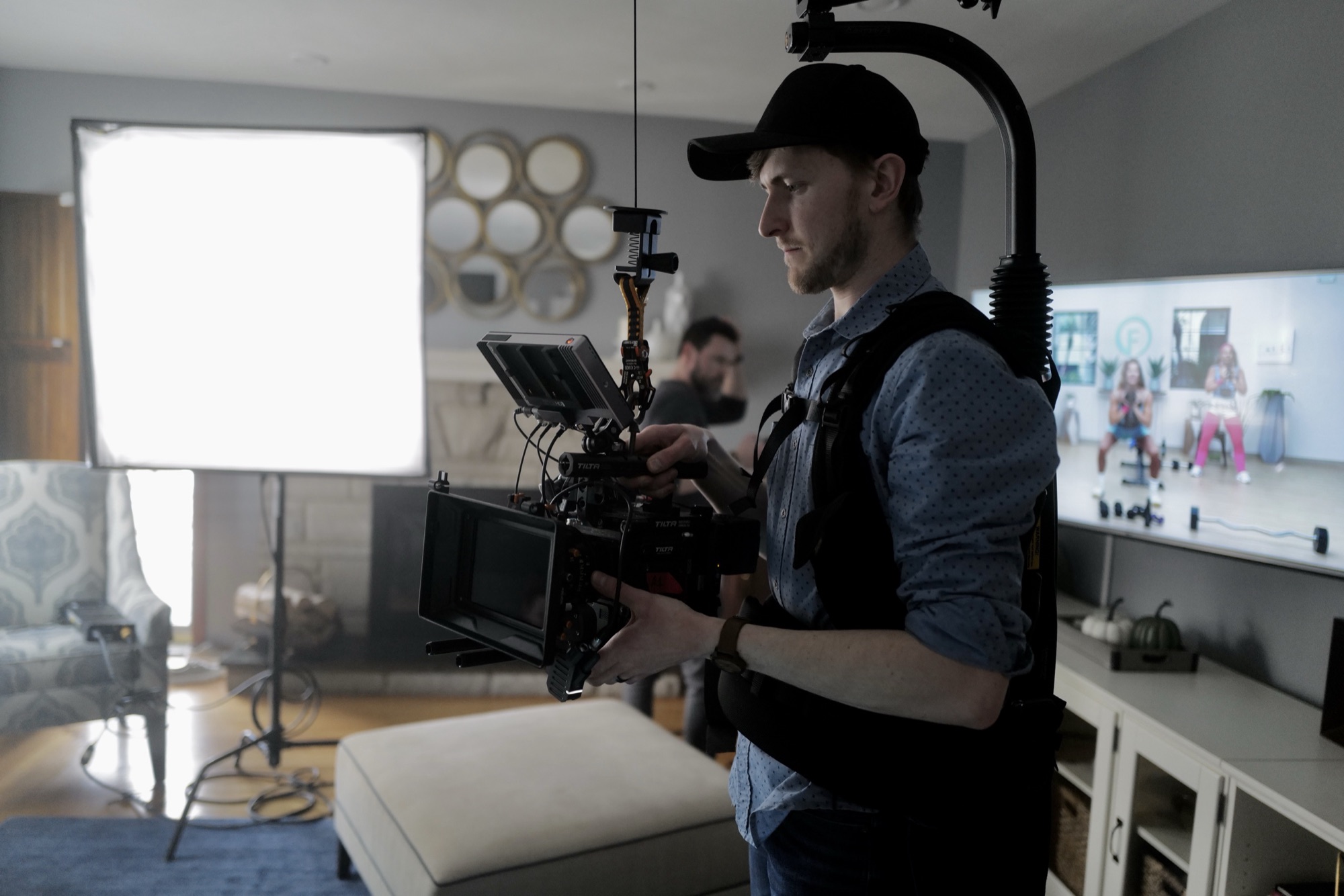 Ryan filming a scene in a family living room